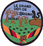 Le badge de camp qui fut remis à tous les participants.
Image JPEG de 117 Ko, YMM.